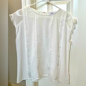 Express winter white blouse with alternating fabric and lace accent sleeves.